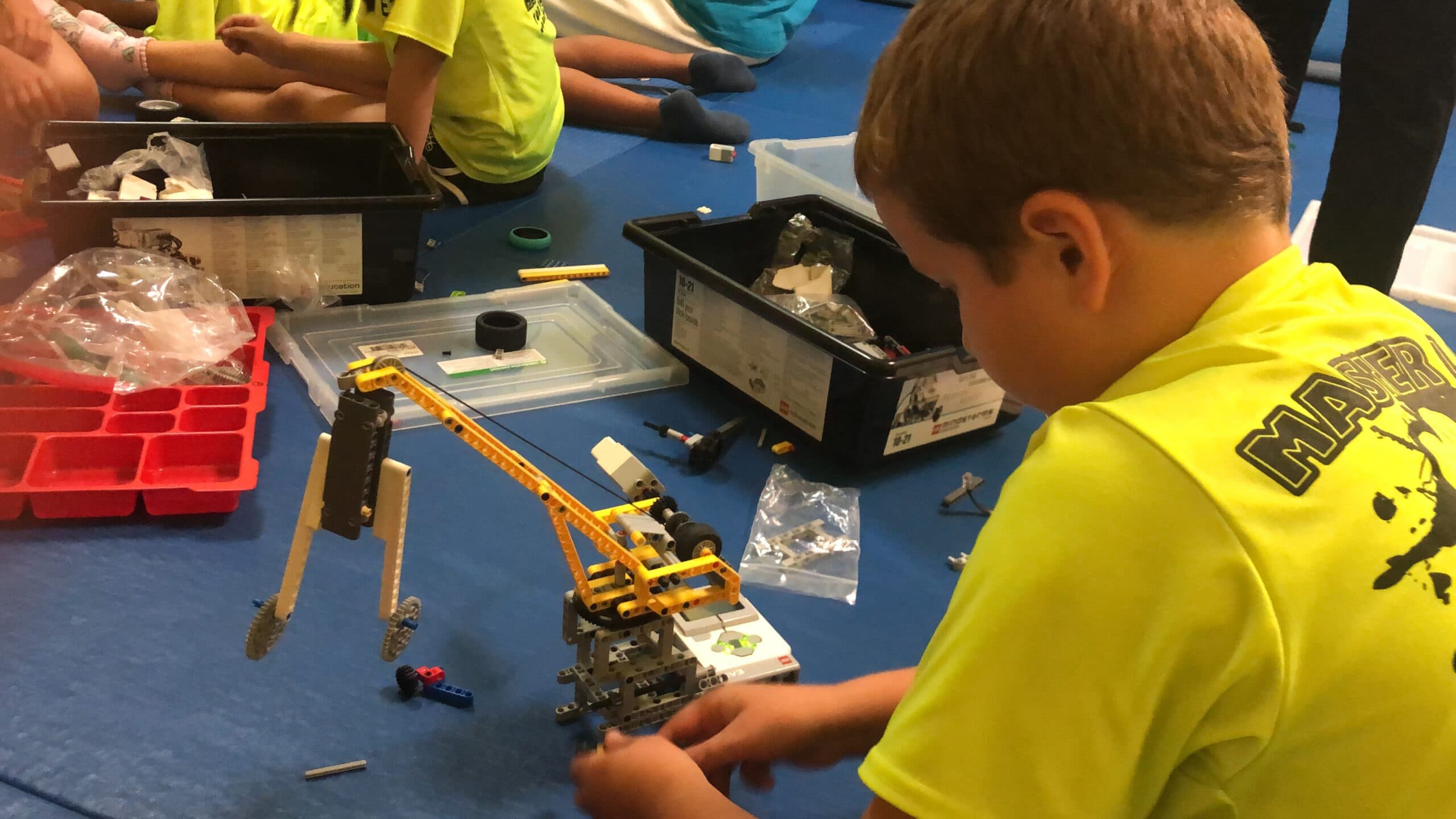 BeaverBots helping kids at an outreach event